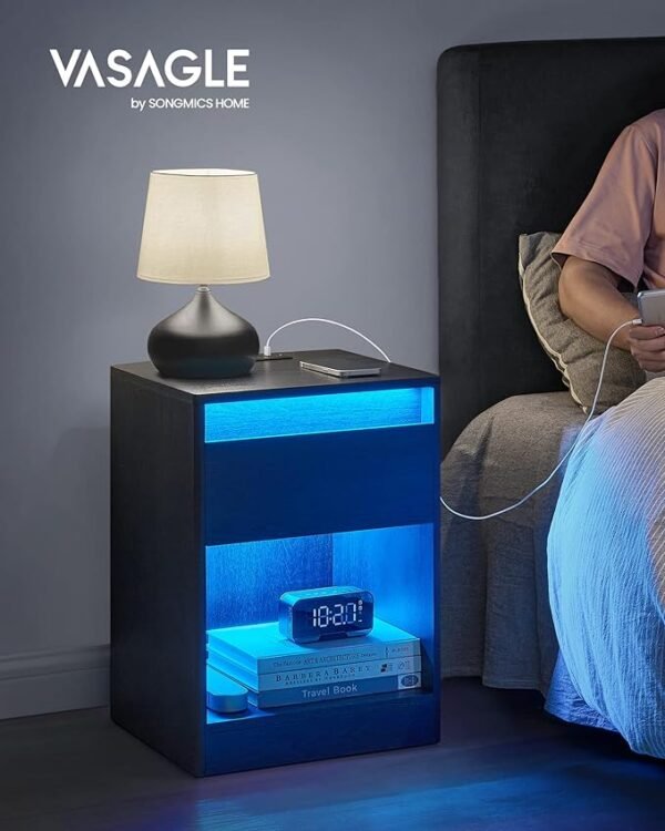 【ADJUSTABLE LED LIGHT COLORS & MODES】The LED lights built into each bedside table boast 25 colors, 6 brightness levels, 3 flashing modes, and 6 blink rates. With the remote control, you can adjust the color and mode to create different atmospheres 【SIDE TABLE WITH CHARGING STATION】Charge up to 4 devices from the comfort of your couch or bed with the built-in power strip with 2 AC outlets, 2 USB ports, and the 6.5 ft extension cord. The cable box on the back hides your cords for a tidy look 【SPACE TO HIDE AND DISPLAY】Spruce up your space with this bedside table. It boasts a spacious tabletop to display arts or plants, an easy-to-open drawer with bevelled edge to tuck away odds and ends, and an open compartment for your favorite books 【BUILT TO LAST】Crafted from 0.6" thick particleboard, these end tables ensure a stable and wobble-free experience, supporting up to 242 lb of each with ease 【HASSLE-FREE ASSEMBLY】With clear instructions and the included assembly tool, you can effortlessly connect the labeled parts and enjoy your new side tables in no time - Image 3